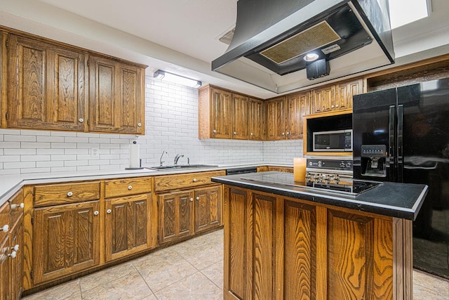 kitchen with black appliances, a kitchen island, ventilation hood, sink, and decorative backsplash