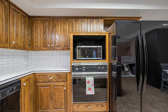 kitchen featuring black appliances and decorative backsplash