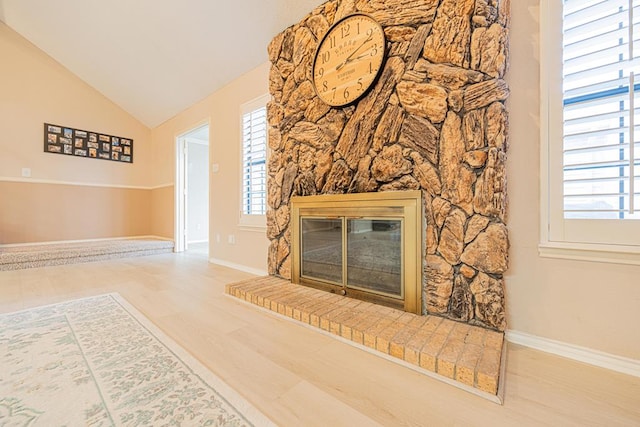 living room with vaulted ceiling and wood-type flooring