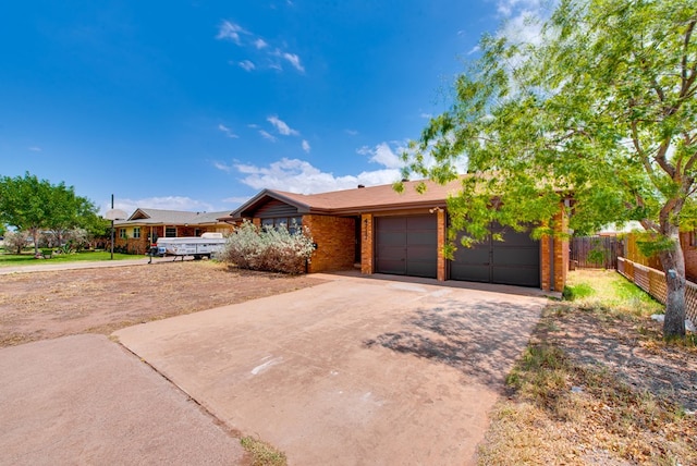 4717 W Illinois Ave, Midland, TX 79703 - single story home featuring driveway, a garage, and brick siding
