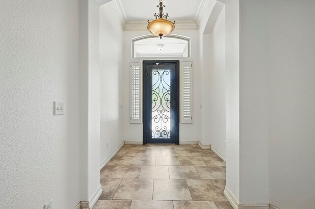 5001 Crista Ln, Midland, TX 79707 - entrance foyer with crown molding, baseboards, and a textured wall