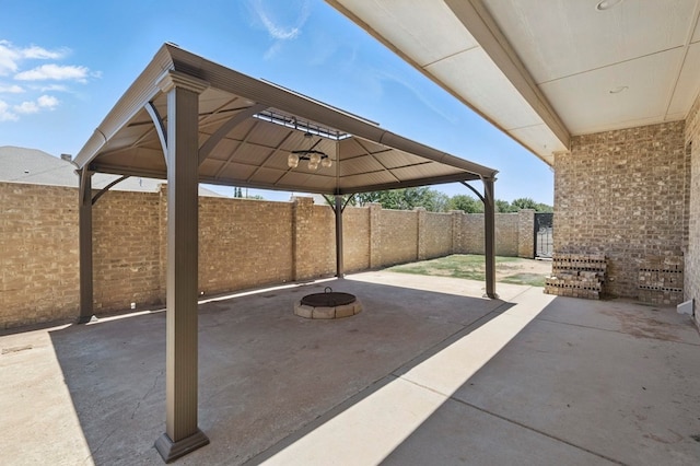 5001 Crista Ln, Midland, TX 79707 - fenced backyard featuring a gazebo, a fire pit, and a patio