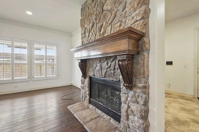 5001 Crista Ln, Midland, TX 79707 - detailed view of ornamental molding, a stone fireplace, baseboards, and wood finished floors