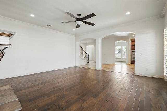 5001 Crista Ln, Midland, TX 79707 - unfurnished living room featuring ceiling fan, crown molding, hardwood / wood-style flooring, recessed lighting, and arched walkways