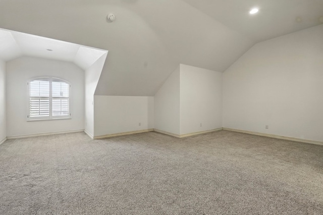 5001 Crista Ln, Midland, TX 79707 - bonus room featuring lofted ceiling, light carpet, and baseboards