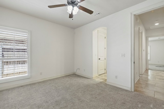 5001 Crista Ln, Midland, TX 79707 - unfurnished room with plenty of natural light, a ceiling fan, light carpet, and baseboards