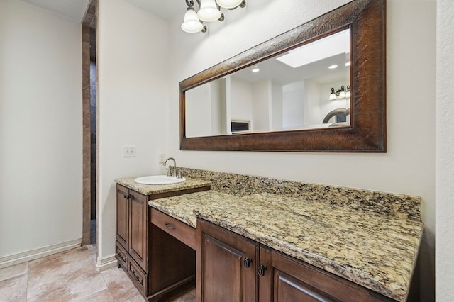 5001 Crista Ln, Midland, TX 79707 - bathroom featuring vanity and baseboards