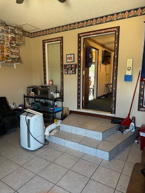 1510 S Fort Worth, Midland, TX 79701 - entryway with tile patterned floors and a textured ceiling