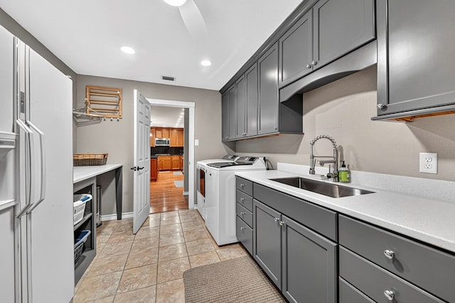 2409 Stutz Pl, Midland, TX 79705 - laundry room with cabinet space, separate washer and dryer, and recessed lighting