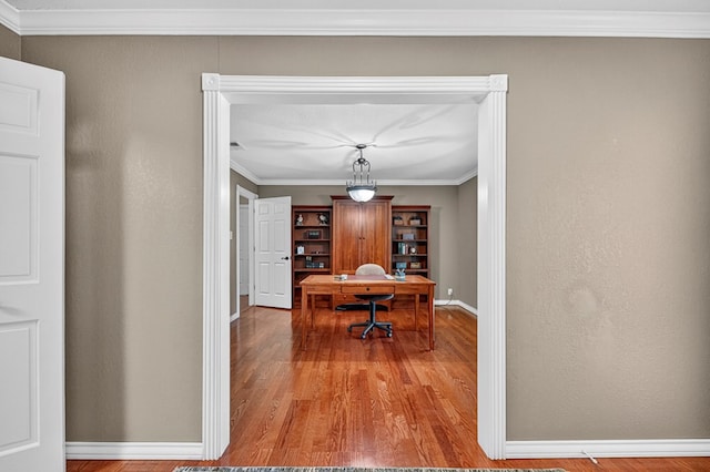2409 Stutz Pl, Midland, TX 79705 - dining space featuring wood finished floors, a desk, and crown molding