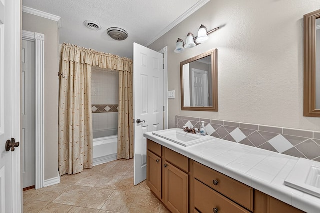 2409 Stutz Pl, Midland, TX 79705 - full bath featuring double vanity, ornamental molding, shower / tub combo with curtain, and backsplash