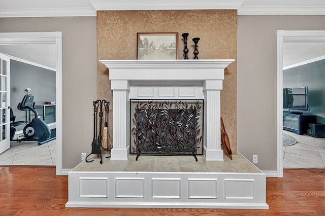 2409 Stutz Pl, Midland, TX 79705 - detailed view of a fireplace, ornamental molding, and wood finished floors