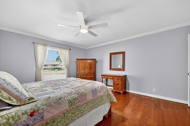 2409 Stutz Pl, Midland, TX 79705 - bedroom featuring wood finished floors, crown molding, ceiling fan, and a textured ceiling