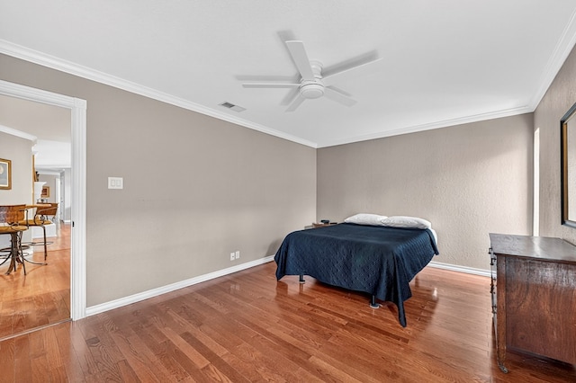 2409 Stutz Pl, Midland, TX 79705 - bedroom featuring wood finished floors, crown molding, and ceiling fan