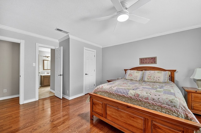 2409 Stutz Pl, Midland, TX 79705 - bedroom featuring wood finished floors, ornamental molding, a textured ceiling, and ceiling fan
