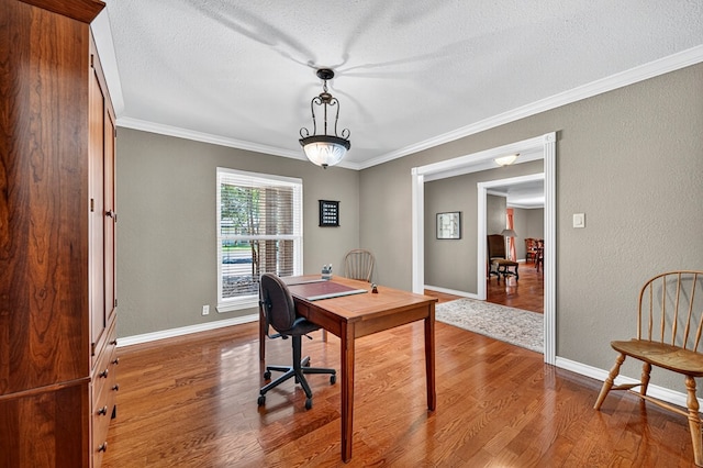 2409 Stutz Pl, Midland, TX 79705 - office with wood finished floors, ornamental molding, a textured ceiling, and a textured wall