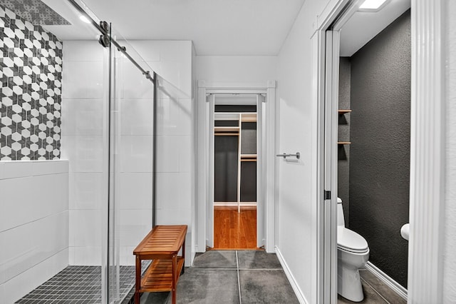 2409 Stutz Pl, Midland, TX 79705 - bathroom with a stall shower and a walk in closet