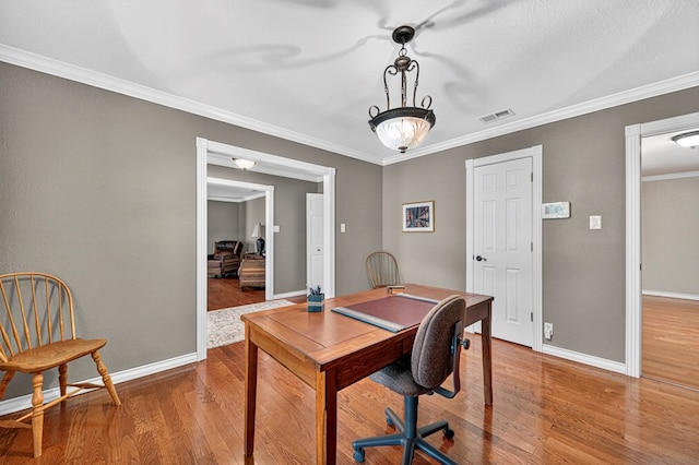 2409 Stutz Pl, Midland, TX 79705 - home office with wood finished floors and crown molding
