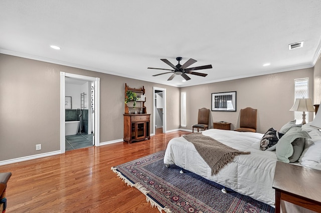 2409 Stutz Pl, Midland, TX 79705 - bedroom featuring crown molding, wood finished floors, a spacious closet, recessed lighting, and a closet