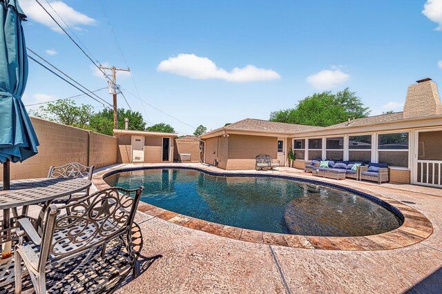2409 Stutz Pl, Midland, TX 79705 - view of pool featuring a patio area, outdoor lounge area, outdoor dining space, and an outbuilding