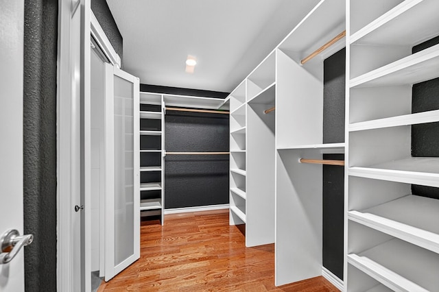2409 Stutz Pl, Midland, TX 79705 - walk in closet featuring wood finished floors
