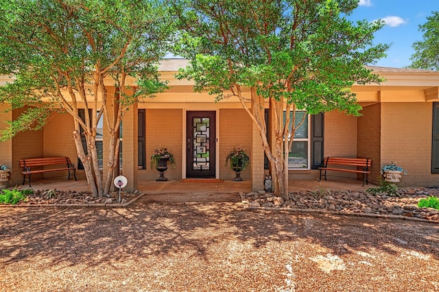 2409 Stutz Pl, Midland, TX 79705 - entrance to property with brick siding and a porch