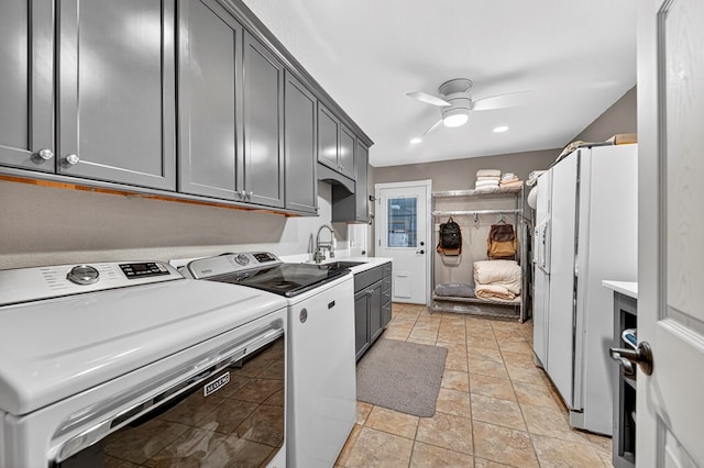 2409 Stutz Pl, Midland, TX 79705 - laundry area featuring cabinet space, a ceiling fan, washing machine and dryer, and recessed lighting