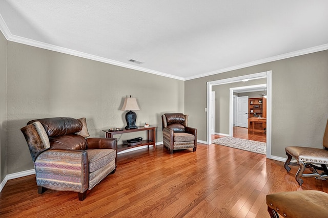 2409 Stutz Pl, Midland, TX 79705 - sitting room featuring ornamental molding and wood finished floors