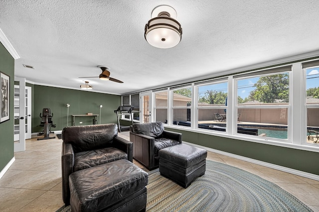 2409 Stutz Pl, Midland, TX 79705 - living area with tile patterned floors, a textured ceiling, ornamental molding, and ceiling fan