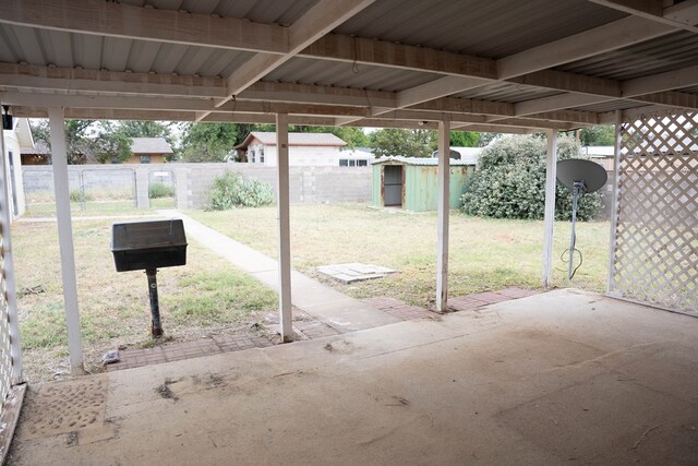 view of patio with a storage shed