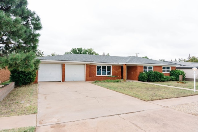 ranch-style home featuring a front lawn and a garage