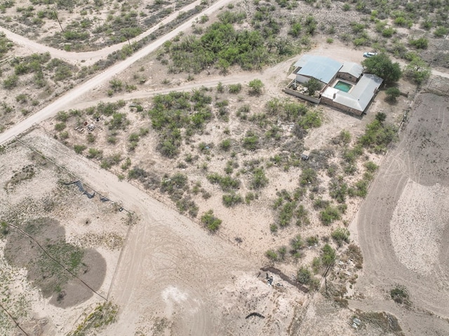 drone / aerial view featuring a rural view and view of desert