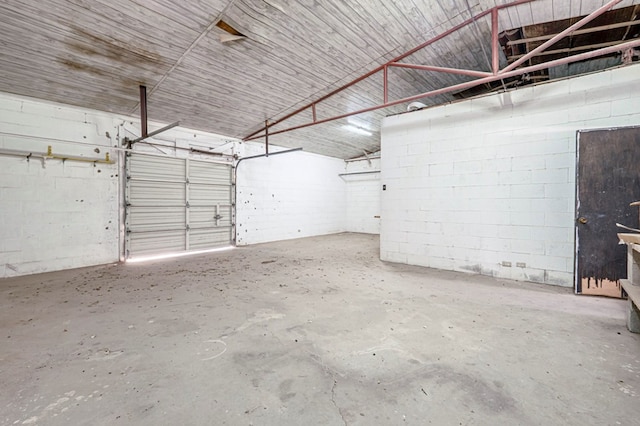 garage featuring concrete block wall