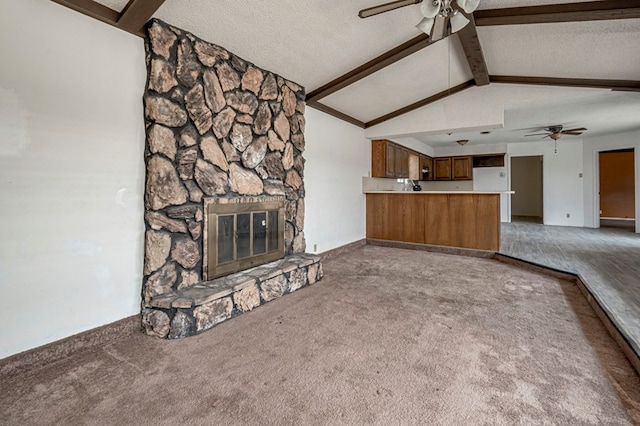 unfurnished living room featuring carpet, a ceiling fan, and vaulted ceiling with beams