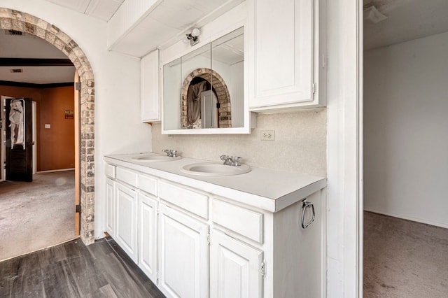 bathroom featuring double vanity and a sink