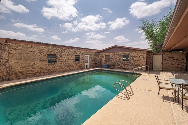 view of pool featuring a fenced in pool and a patio area