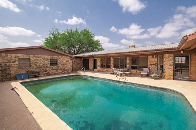 pool with a patio area