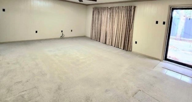 empty room featuring light carpet