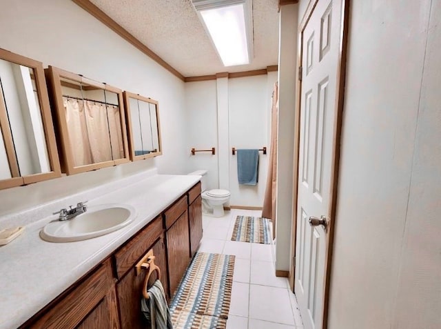 bathroom with crown molding, toilet, a textured ceiling, vanity, and tile patterned floors