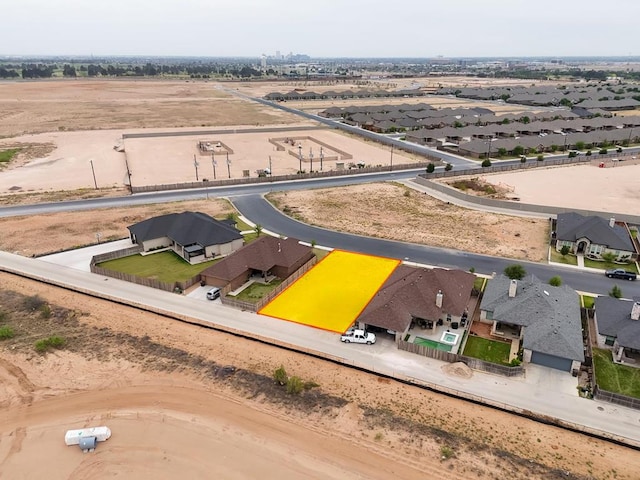 birds eye view of property with a residential view