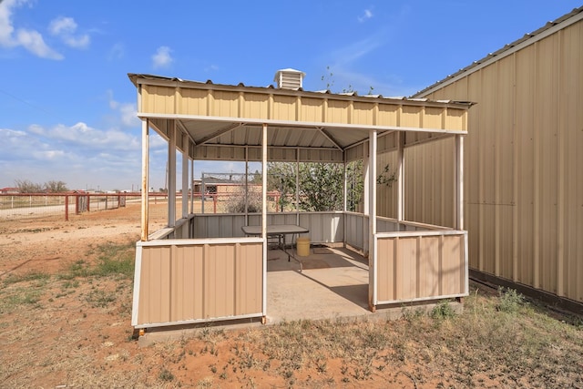 exterior space featuring a gazebo and fence