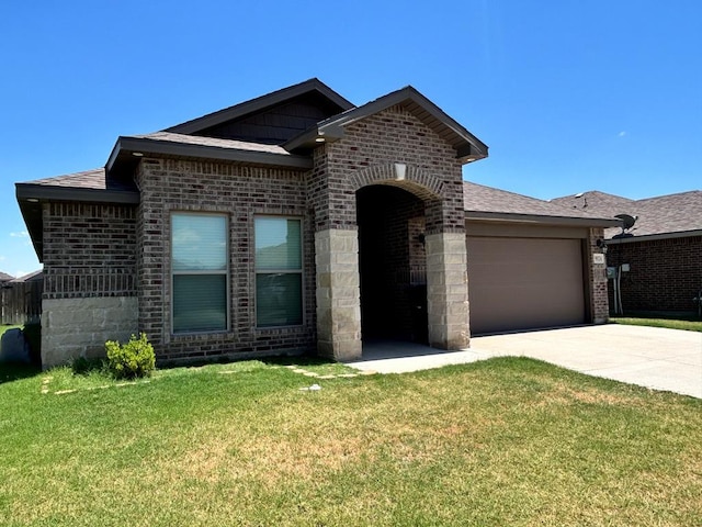 view of front facade with a garage and a front lawn