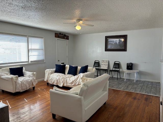 living room with hardwood / wood-style floors, a textured ceiling, and ceiling fan