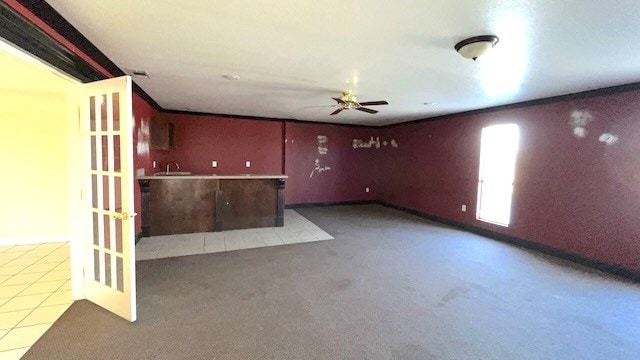 unfurnished room featuring ceiling fan and sink