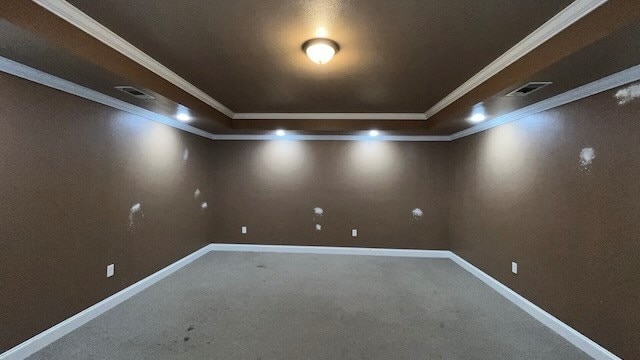 spare room featuring carpet flooring and crown molding