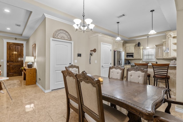 dining space with ornamental molding and a notable chandelier