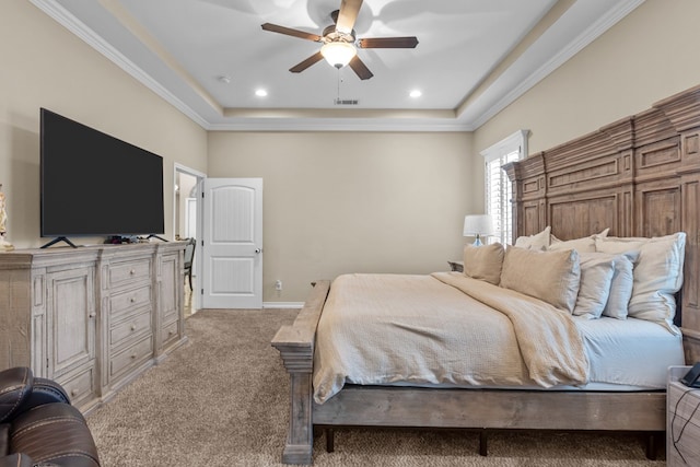 bedroom featuring ceiling fan, light colored carpet, crown molding, and a raised ceiling