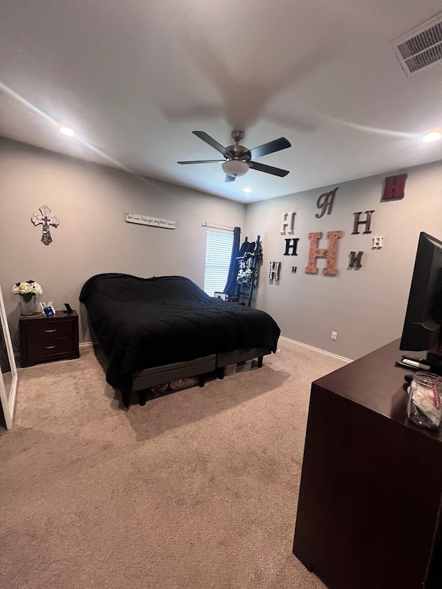 bedroom featuring light carpet and ceiling fan