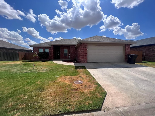 view of front of home featuring a garage and a front lawn