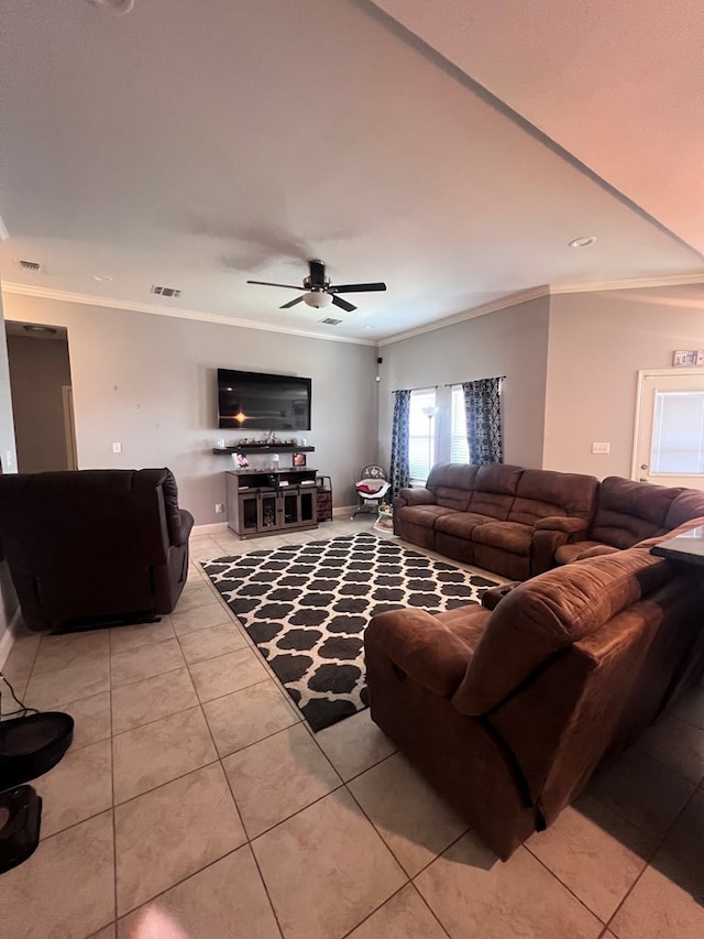 tiled living room featuring crown molding and ceiling fan